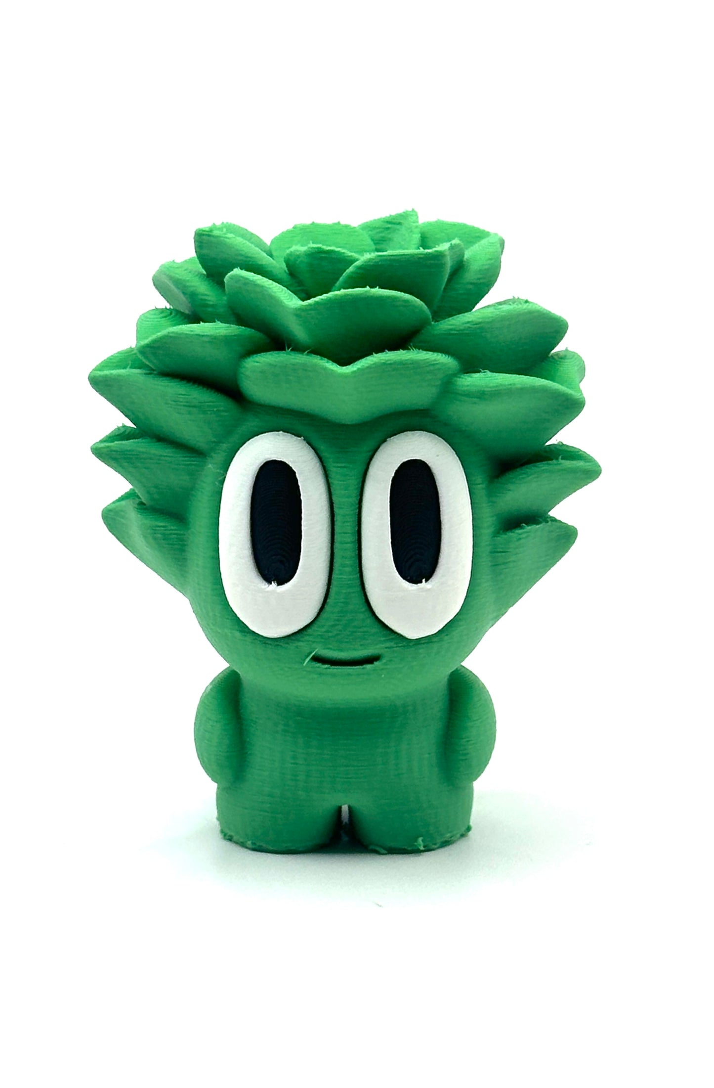 Green cartoon-like character with large eyes on a white background