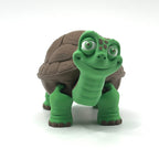 Toy turtle figurine with a white background