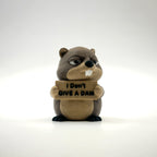 I Don't Give a Dam Beaver 3D printed desk buddy holding its sign, front view
