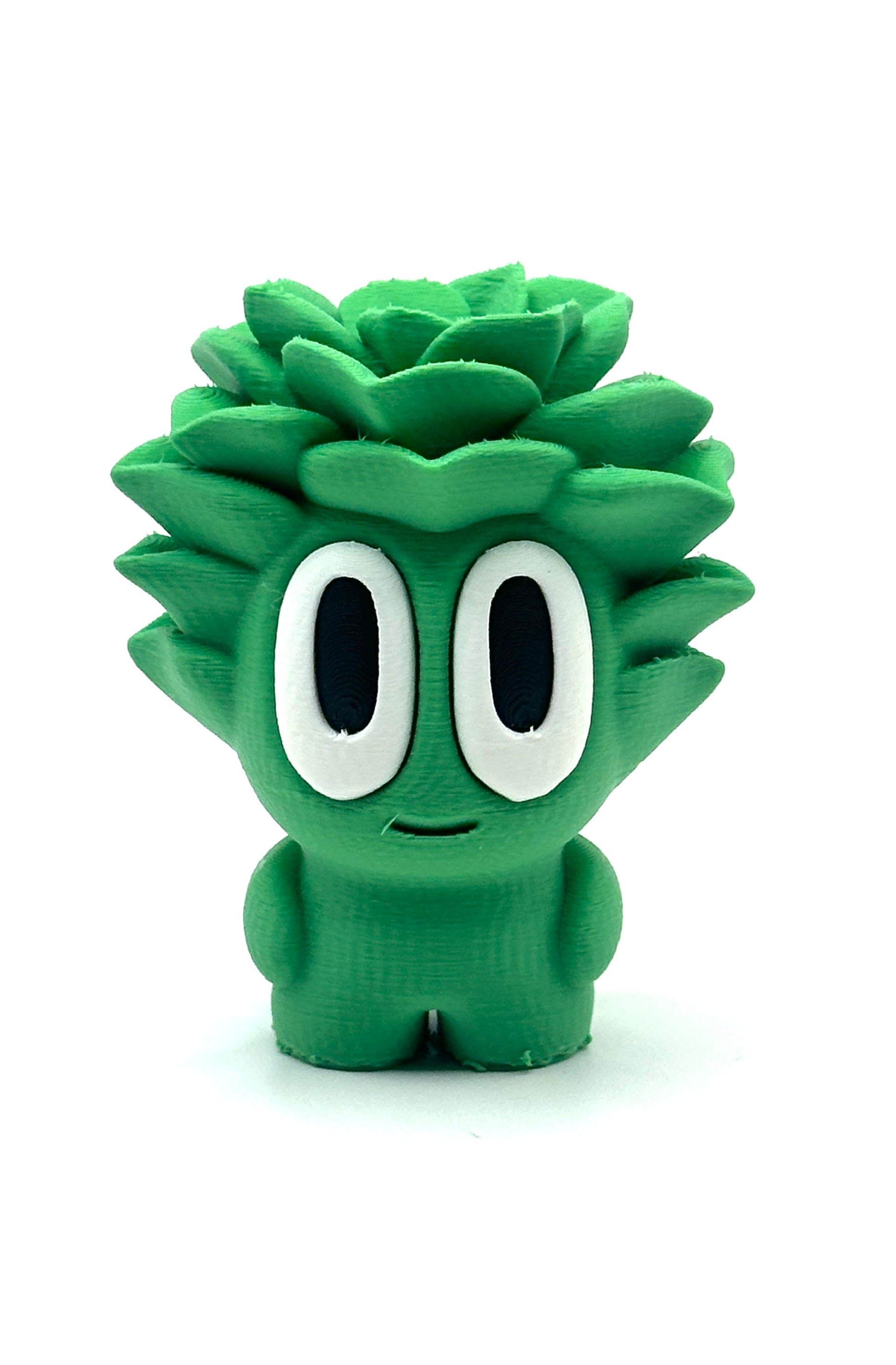 Green cartoon-like character with large eyes on a white background
